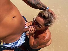 Mature Latina milf Cassiana Costa gives a blowjob on a public beach